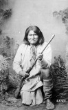 Geronimo_(Goyathlay),_a_Chiricahua_Apache,_full-length,_kneeling_with_rifle,_1887_-_NARA_-_530880